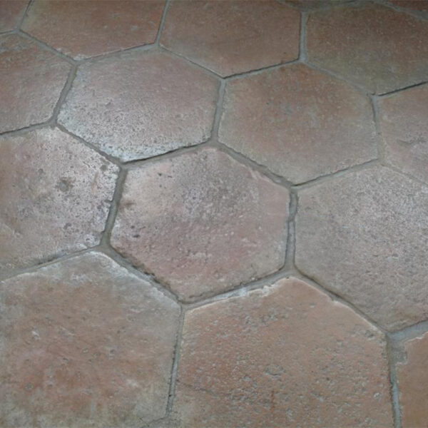 flooring in large antique hexagonal terracotta tiles