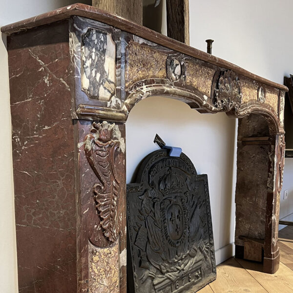 French red fireplace in marble stone