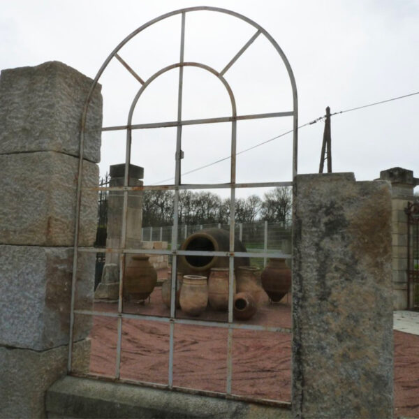 industrial style arched window in wrought iron