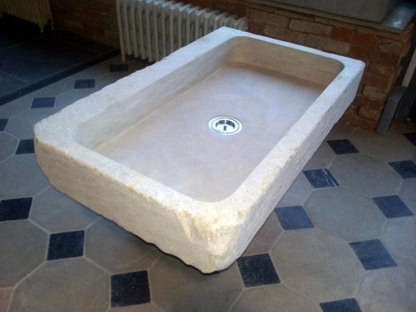 stone sink or washbasin in beige limestone