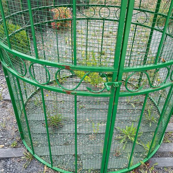 Circular birdcage in steel and zinc outside