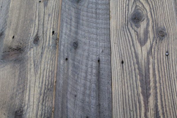 Reclaimed slow-growth pine wall cladding, which has been straight-edged and surface brushed.
