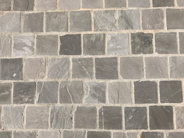 grey khandla pavers outside in front of house