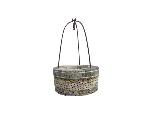 Antique stone well head