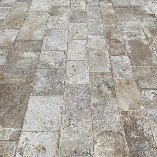 Patinated light colored paving
