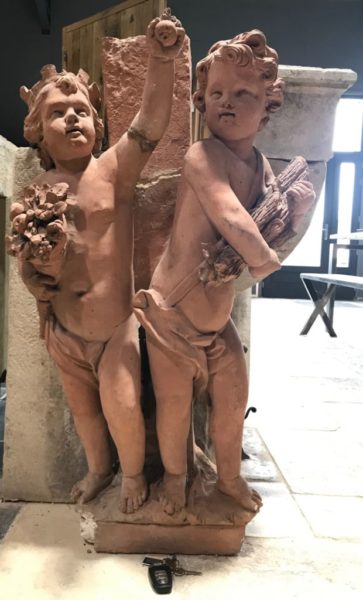 terra cotta statue cherubs playing
