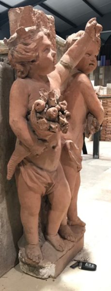 antique cherubs in terra cotta statue many pairs
