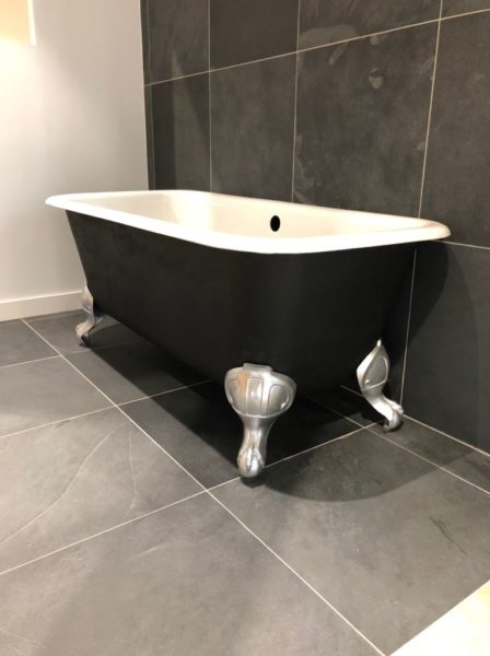 antique bathtub in black, silver and white