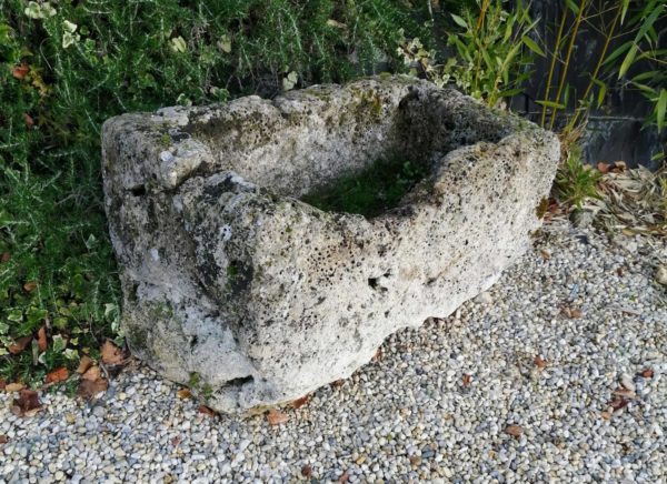 antique limestone trough in grey and white color