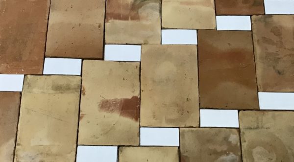 reclaimed parefeuille and glazed rectangle floor tiles