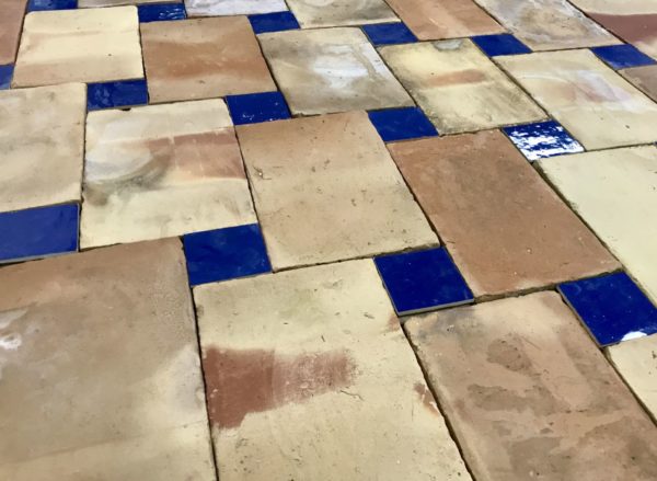 reclaimed terractotta floor with blue zellige