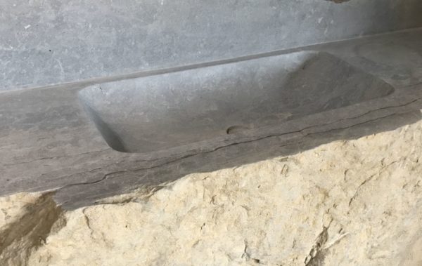 stone sink in a beautiful piece of rock