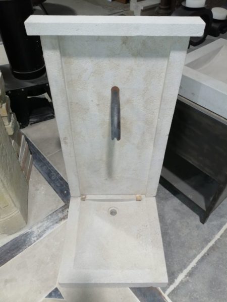limestone fountain at our showroom with antique materials