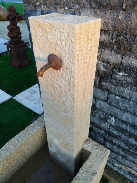 small new limestone fountain with hand tooledfountain