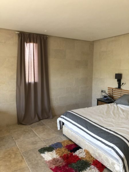 beige limestone wall cladding in a room