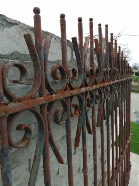 zoom on antique wall grill in iron