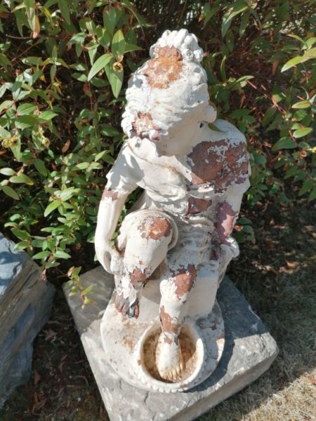 antique woman bathing statue