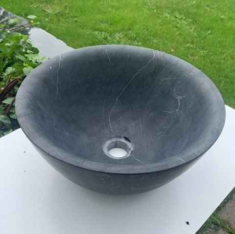 rounded bluestone sink or washbasin