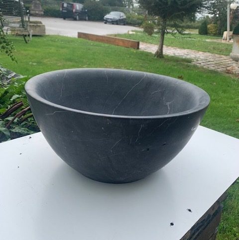 rounded bluestone washbasin with a 33cm diameter
