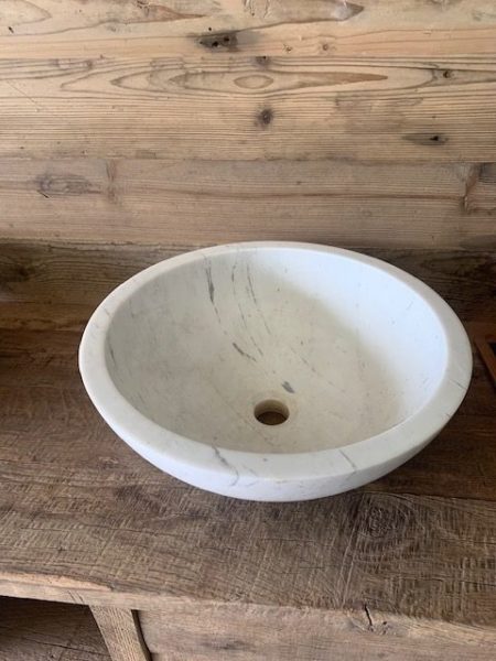 rounded marble and limestone washbasin