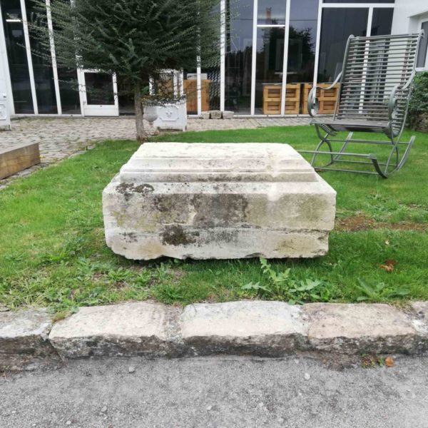 limestone plinth in a garden
