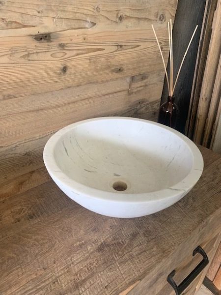 rounded washbasin in marble