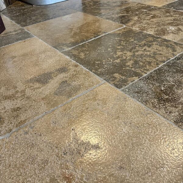 antiqued limestone cognac floor