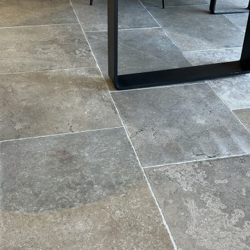 Antiqued limestone cognac floor