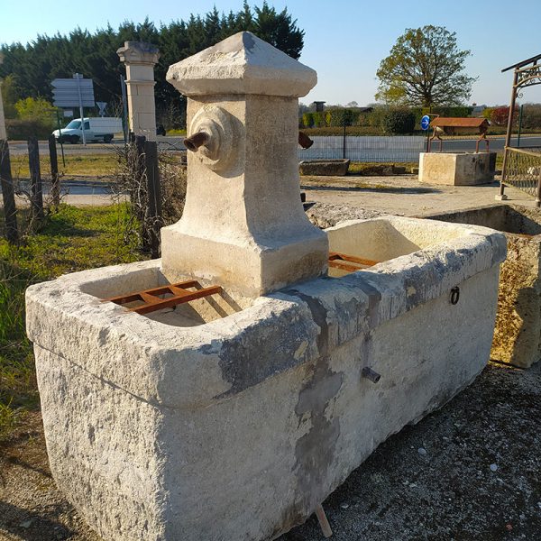 large antique fountain with 2 bac