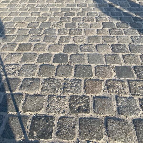 Worn patina of porphyry paving