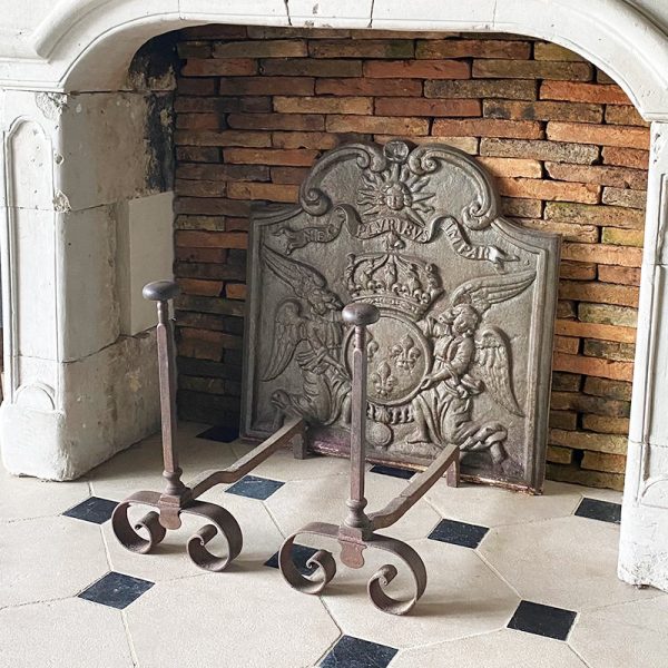Antique andirons forged by blacksmith