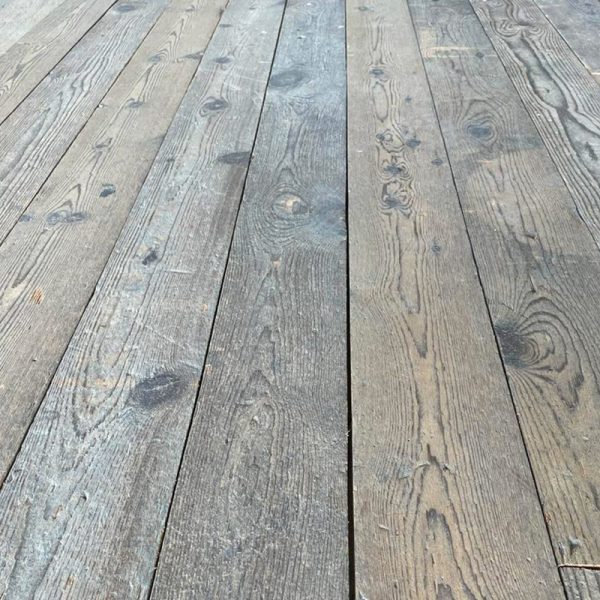 Reclaimed long pine floorboards