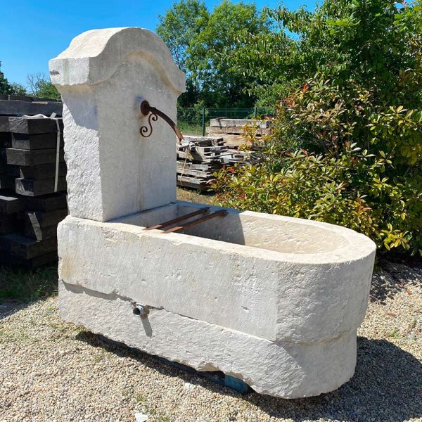 Antique charming village fountain with pool