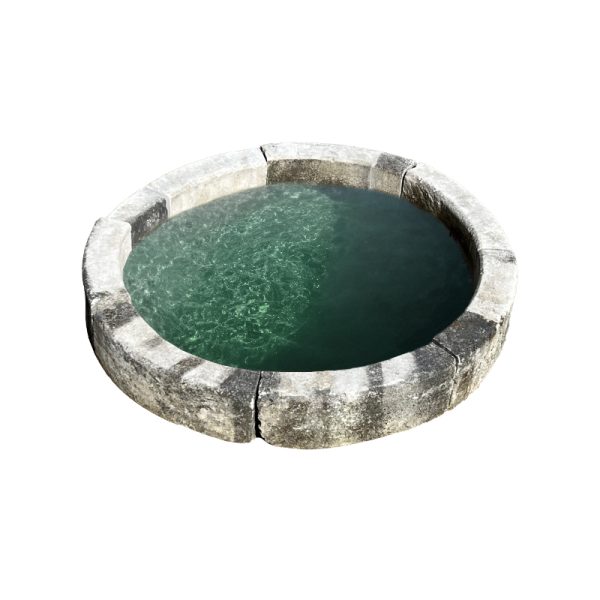 Stone pool surround garden feature with water