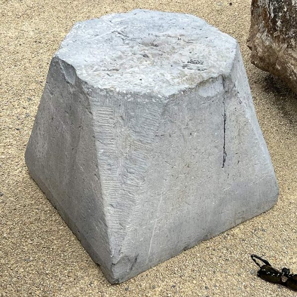 Antique stone plinth in limestone