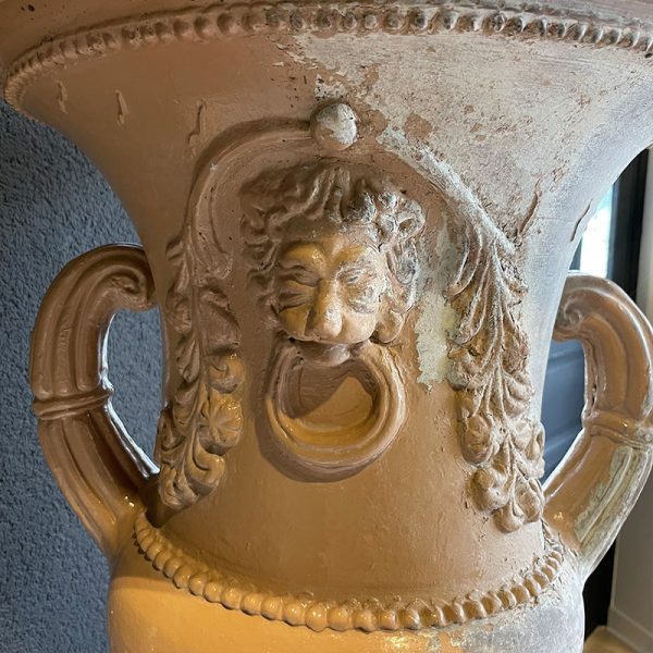 Antique vase with Lions face