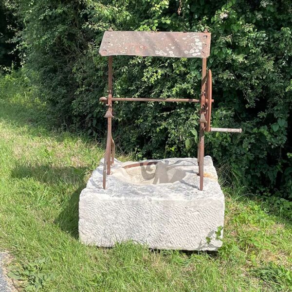 Charming antique well head with gear