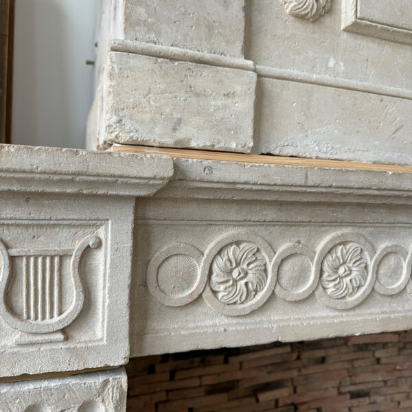 sculpted stone fireplace lintel