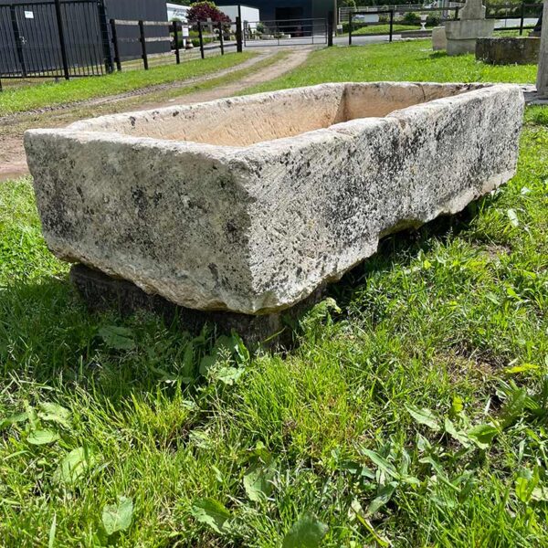 large antique natural stone trough