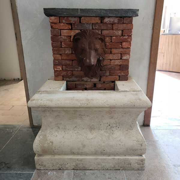 antique fountain with lion head