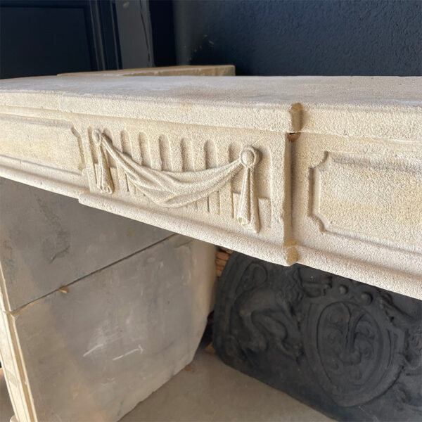 drape ornament over fluting stone fireplace