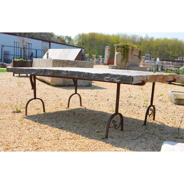large outdoor table in black natural stone