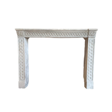 Stone fireplace in Louis XVI style with an interlaced frieze