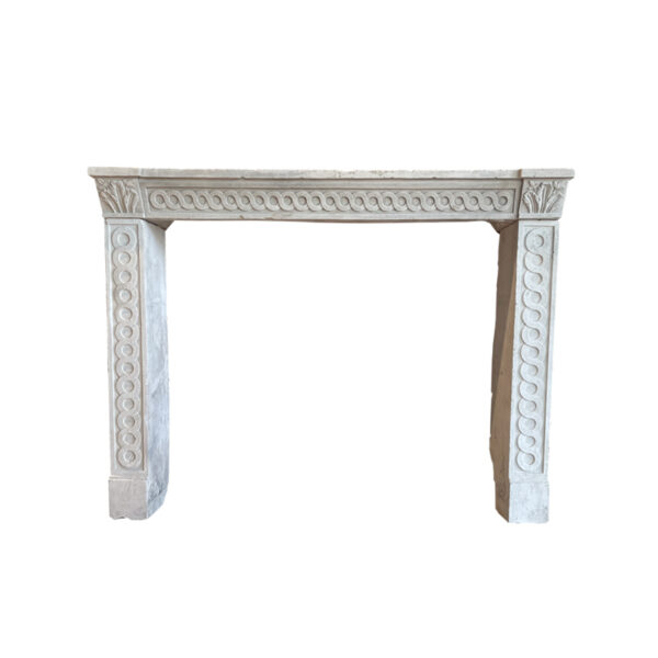 Stone fireplace in Louis XVI style with an interlaced frieze