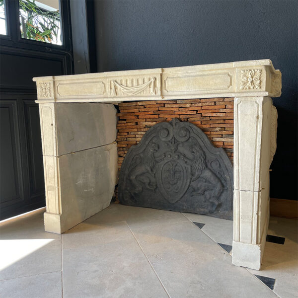 stone fireplace with bas relief sculpture