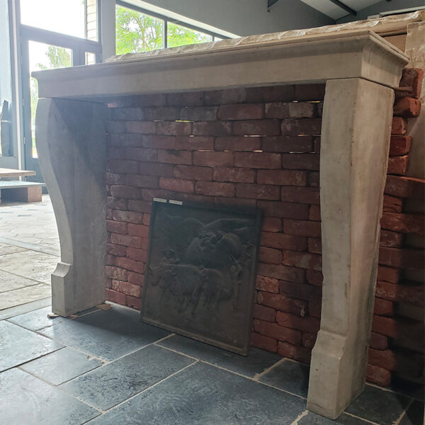 stone fireplace with curved jambs