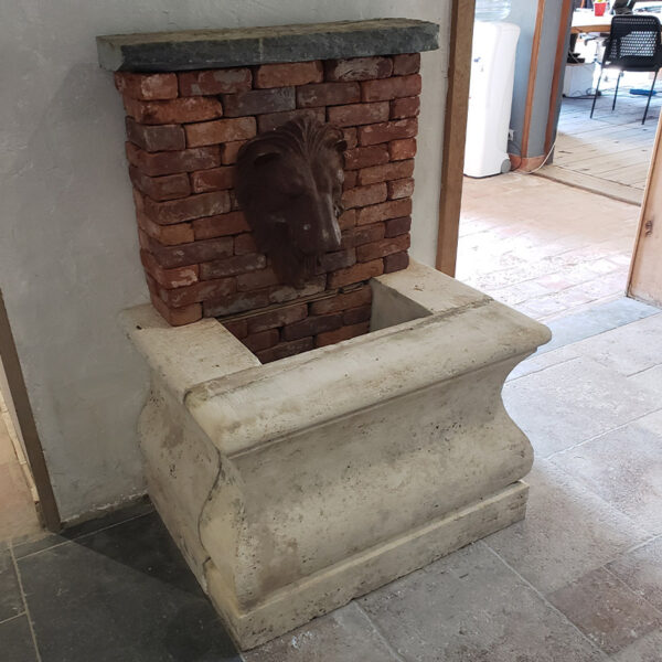 wall fountain with antique brick backing