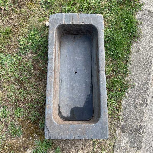 antique trough in slate with drainage hole