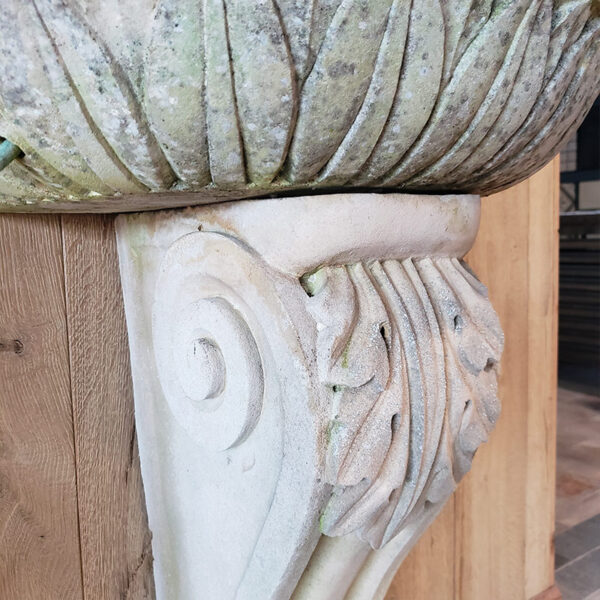 carved acanthus leaf on stone column