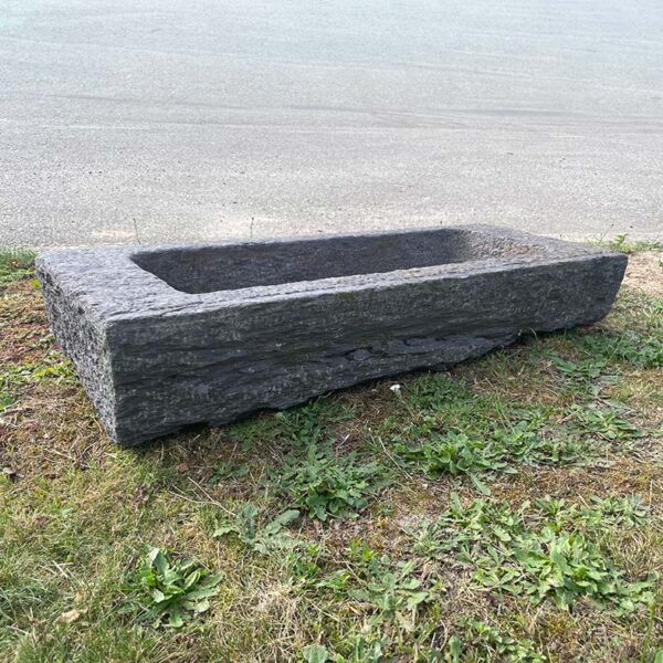 long trough carved from slate